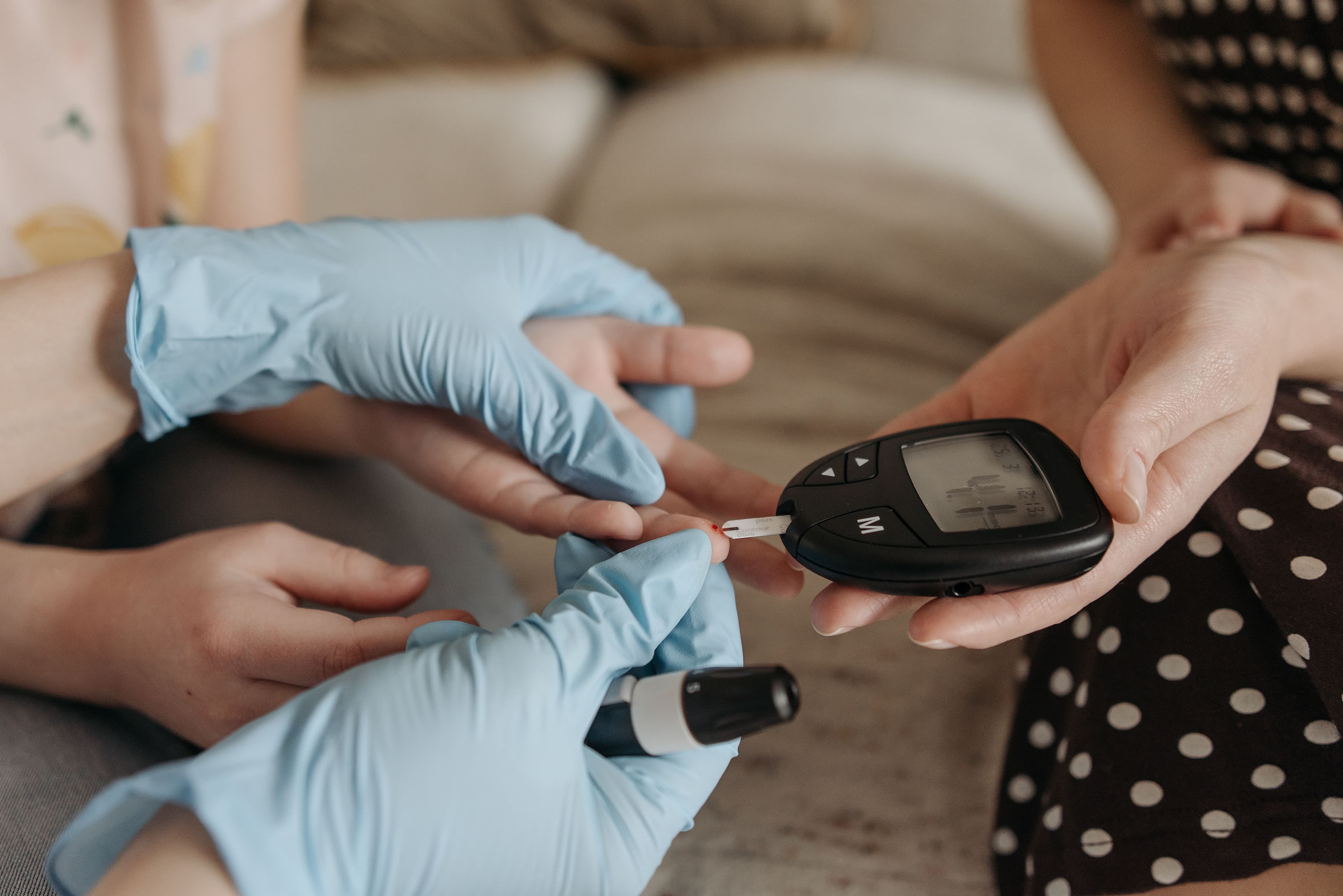 A CNA student practicing a blood glucose check